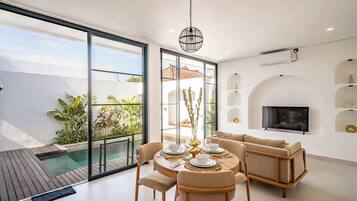 Villa, 1 Bedroom, Bathtub | Living area | 50-inch flat-screen TV with digital channels, TV