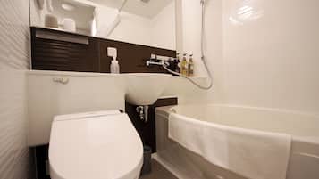 Un baño moderno con inodoro, lavamanos y bañera.