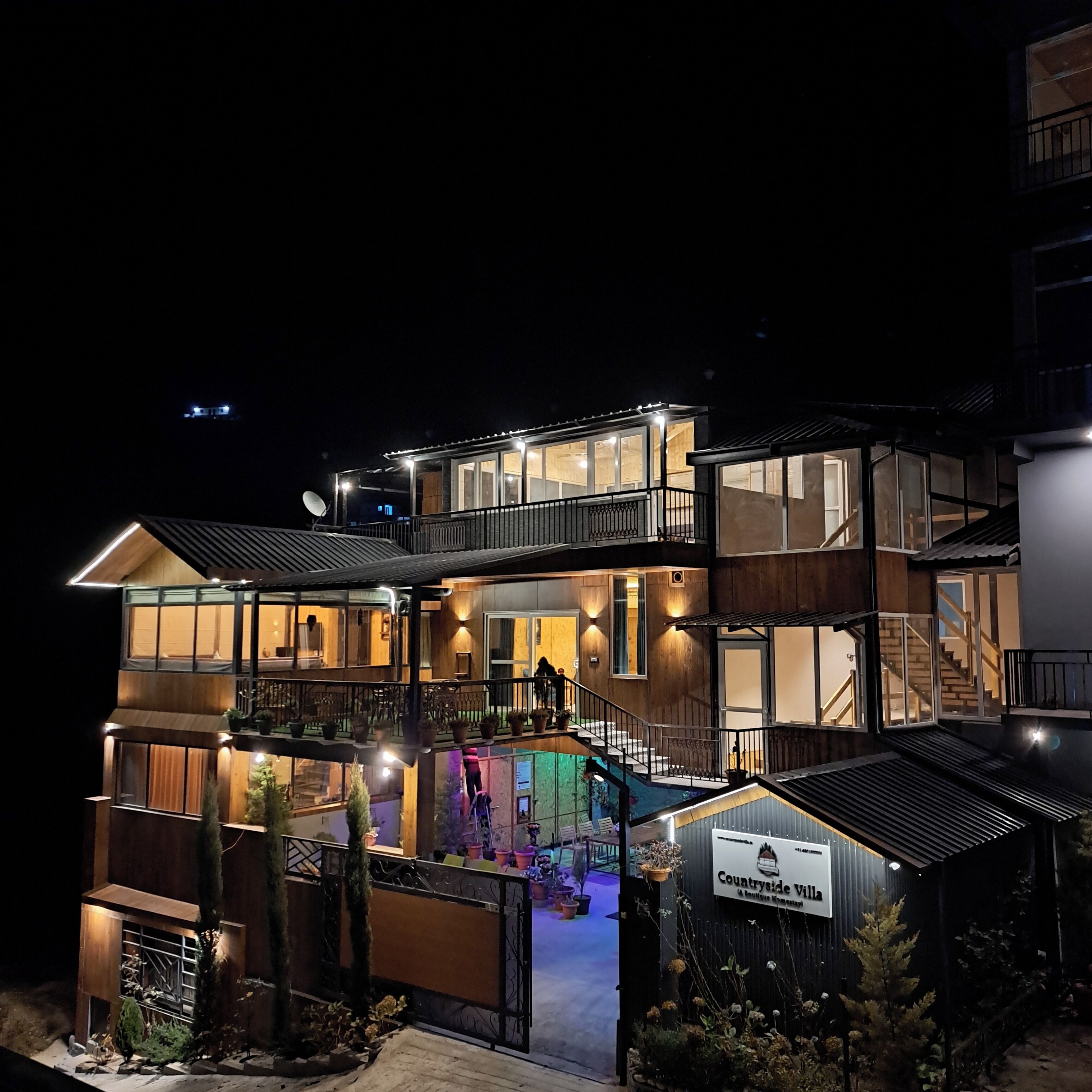 A multi-story building with a sign reading "Countryside Villa."