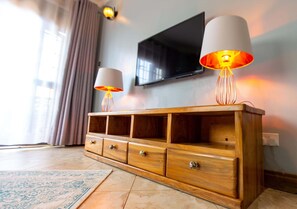Deluxe Apartment | Living area | Smart TV - Villa Karibu Serviced Apartments (Kampala)