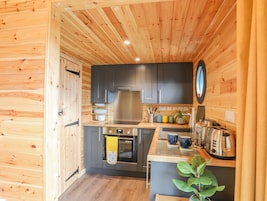 Fridge, electric kettle, cookware/dishes/utensils
