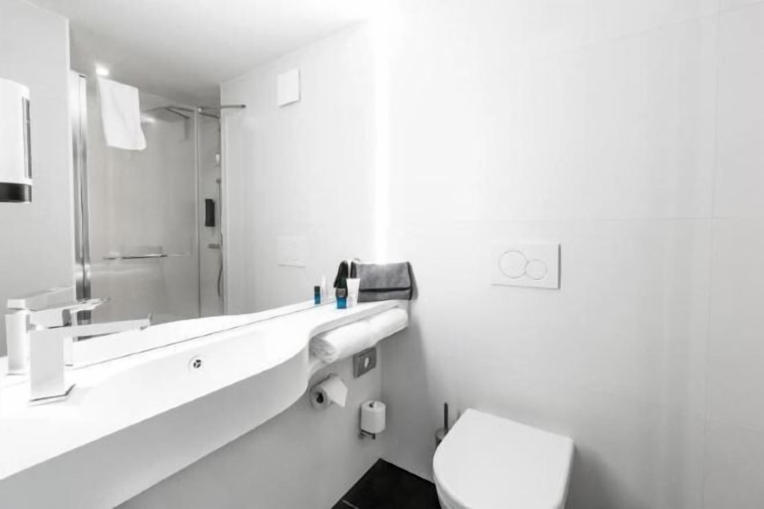 Bathroom | Shower, hair dryer, towels, toilet paper