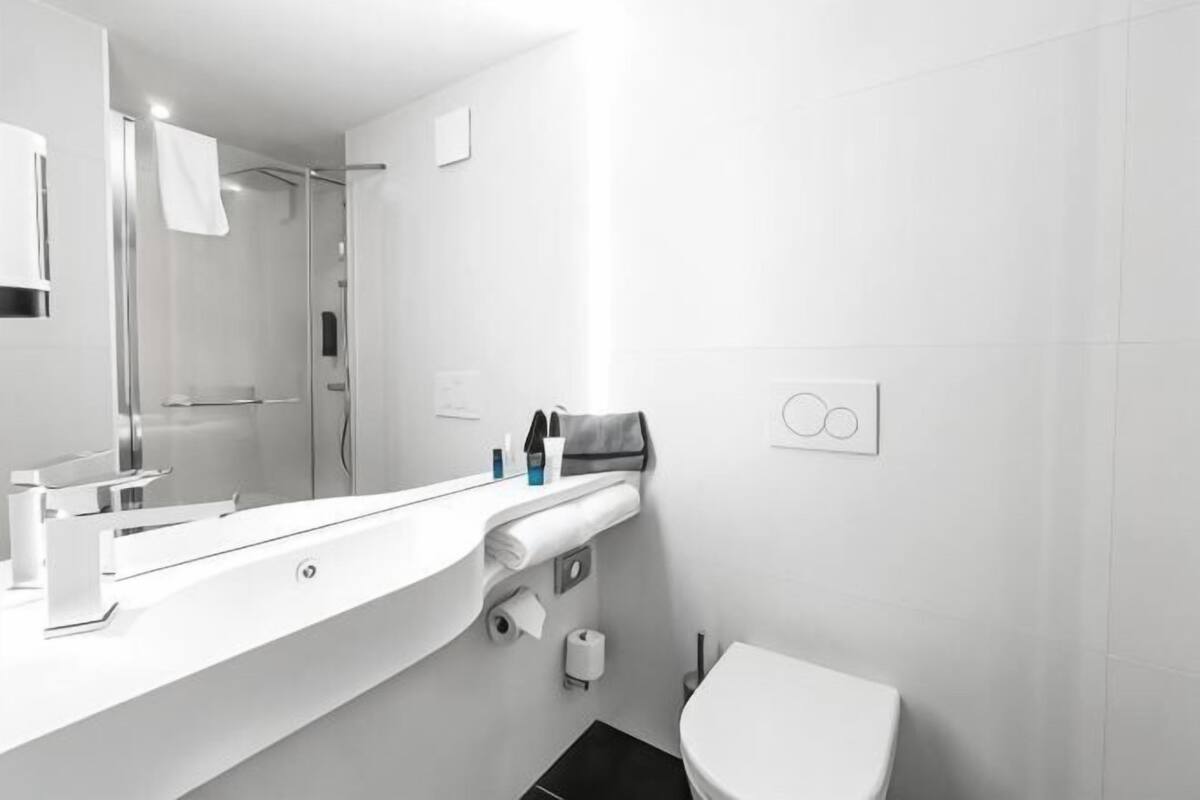 Bathroom | Shower, hair dryer, towels, toilet paper