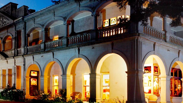 A historic building with multiple arches and a balcony. - Kilmany Park Estate (Wurruk)