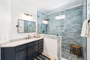 Bathtub, hair dryer, towels, soap