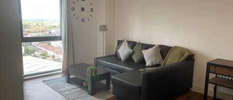 Apartment | Living area | 30-inch TV with cable channels