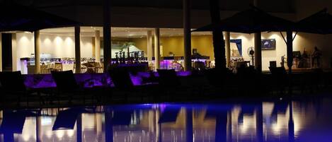 Outdoor pool, pool umbrellas, lifeguards on site