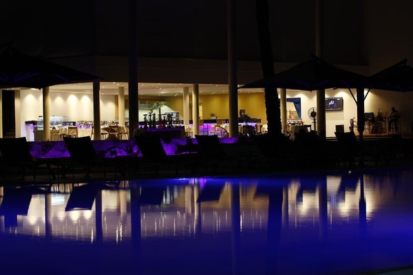 Outdoor pool, pool umbrellas, lifeguards on site