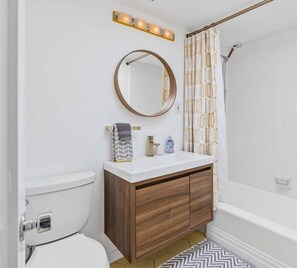 Bathtub, hair dryer, towels, soap