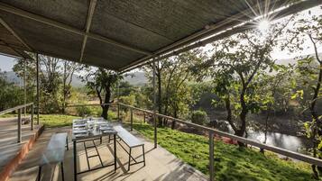 Enjoy dining al fresco with a breathtaking view of the surrounding landscape from this outdoor terrace.
