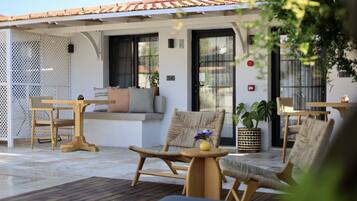 Deluxe Pool Room | Living area | 82-inch LED TV with satellite channels, TV