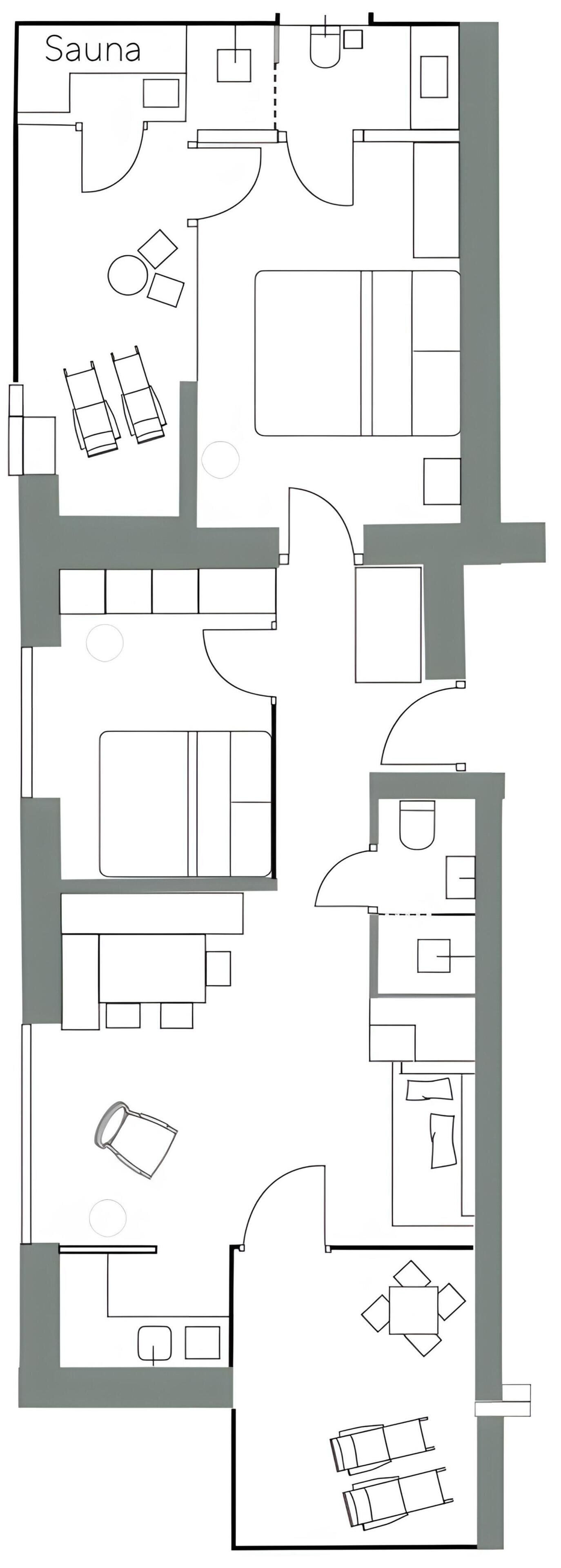 Plano de planta que muestra una sauna, un comedor y una sala de estar con chimenea.