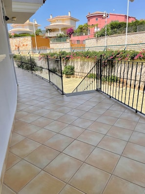 Enjoy breathtaking views of the Mediterranean-inspired neighborhood from this balcony.