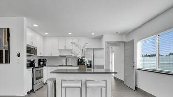 Classic House | Private kitchen | Stovetop, toaster, toaster oven, cleaning supplies