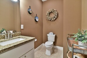 Bathtub, hair dryer, towels, shampoo