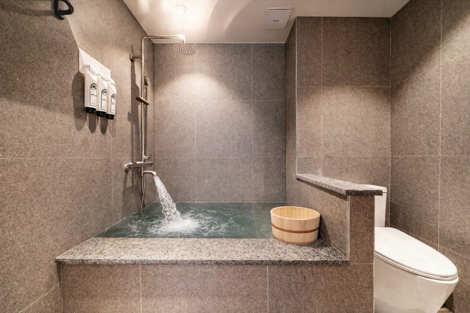 A modern bathroom with a shower, a toilet, and a wooden bucket.