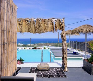 Junior Suite, Sea View | Minibar, individually decorated, individually furnished, desk