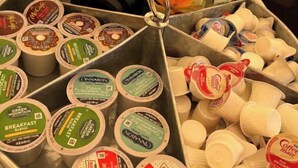 A tray with various coffee pods and a McCafe cup holder. - King Bell Tent at Lake Texoma (Kingston)