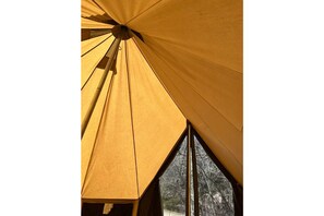 Experience the perfect blend of shelter and nature in this spacious, tent-like accommodation.
