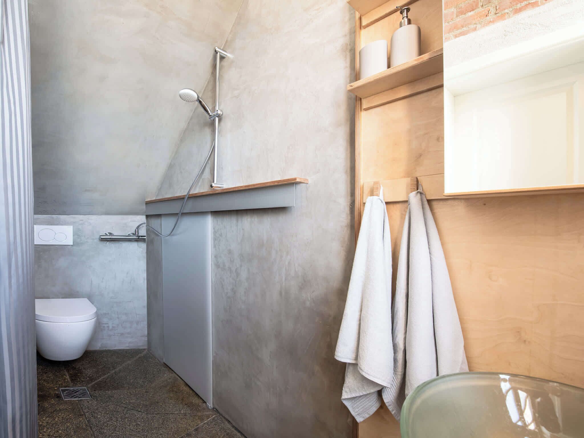 Shower, hair dryer, soap, toilet paper