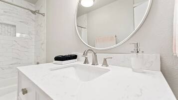 Combined shower/bathtub, hair dryer, towels, soap