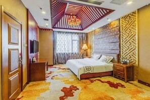 Relax in a traditional room with a large bed, nightstand, and decorative panel.