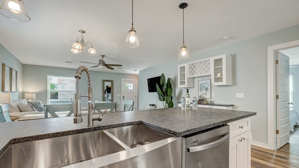 A modern kitchen with a large island, stainless steel appliances, and pendant lighting. - Seascape - Blue🐬 PRIVATE POOL✔️3-MIN WALK to BCH✔️ (Butler Beach)