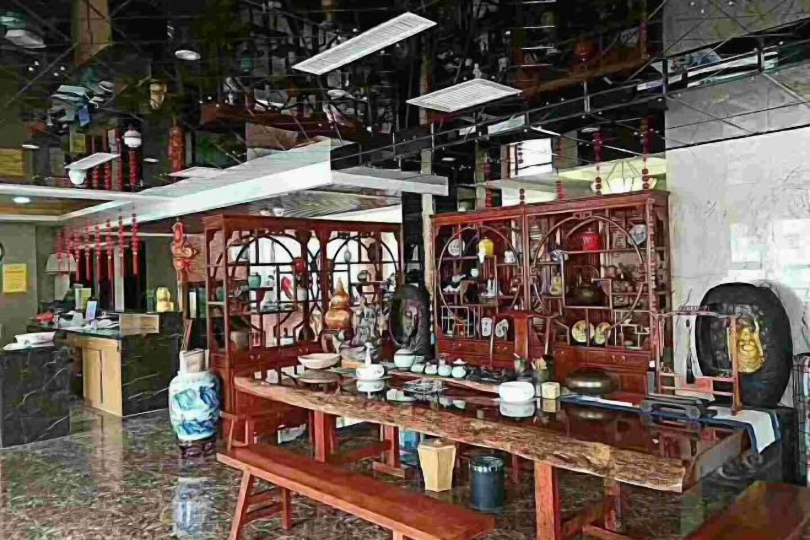 A traditional Chinese tea house with wooden furniture and tea sets.