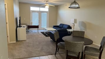 Deluxe Apartment, 2 Bedrooms | Living area | 49-inch LED TV with digital channels, TV, streaming services