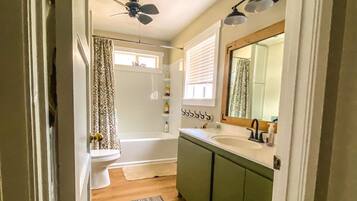 Combined shower/tub, hair dryer, towels, soap