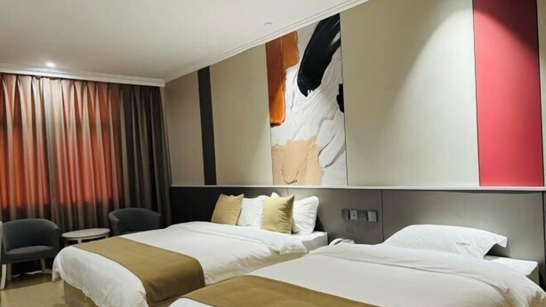 A hotel room with two beds, a desk, a chair, and a large abstract painting on the wall. - Hongye Hotel (Langxi)