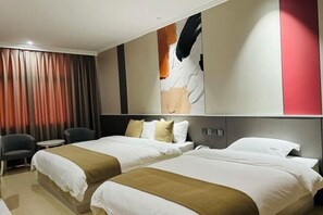 A hotel room with two beds, a desk, a chair, and a large abstract painting on the wall. - Hongye Hotel (Langxi)