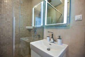 Shower, towels, toilet paper