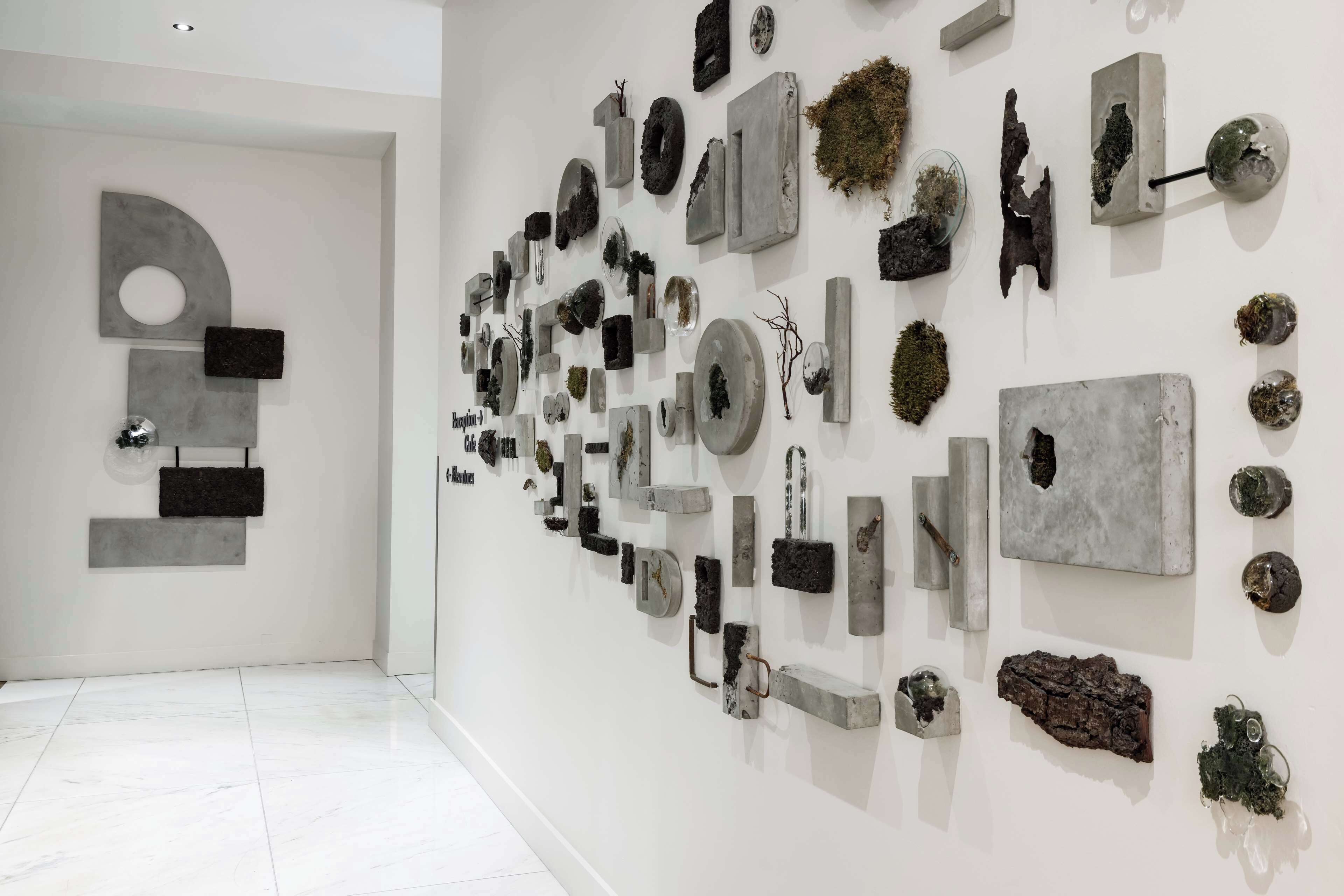 A modern art gallery with various sculptures and installations on display.