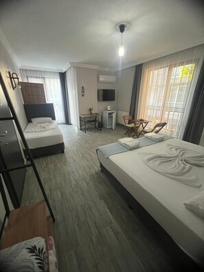Standard Room, Multiple Beds, Non Smoking, Pool View | Free WiFi, bed sheets
