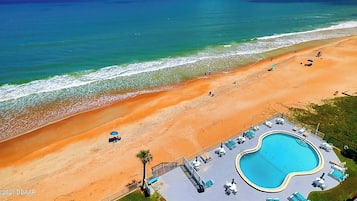 On the beach, sun loungers, beach towels