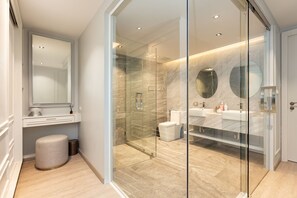 A modern bathroom with a glass-enclosed shower, marble flooring, and dual sinks. - 3br Luxury Beachfront Pool Villa (Rawai)