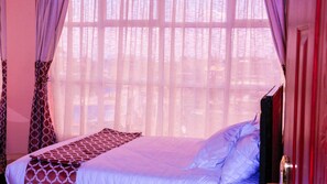 Blackout curtains, iron/ironing board, free WiFi, bed sheets