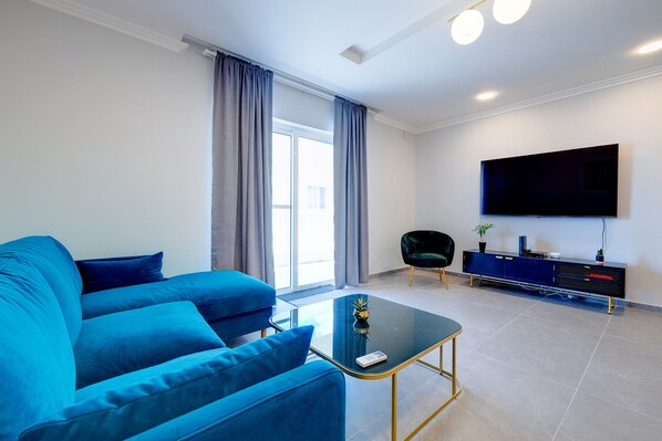 Apartment (3 Bedrooms) | Living area | 44-inch TV with cable channels