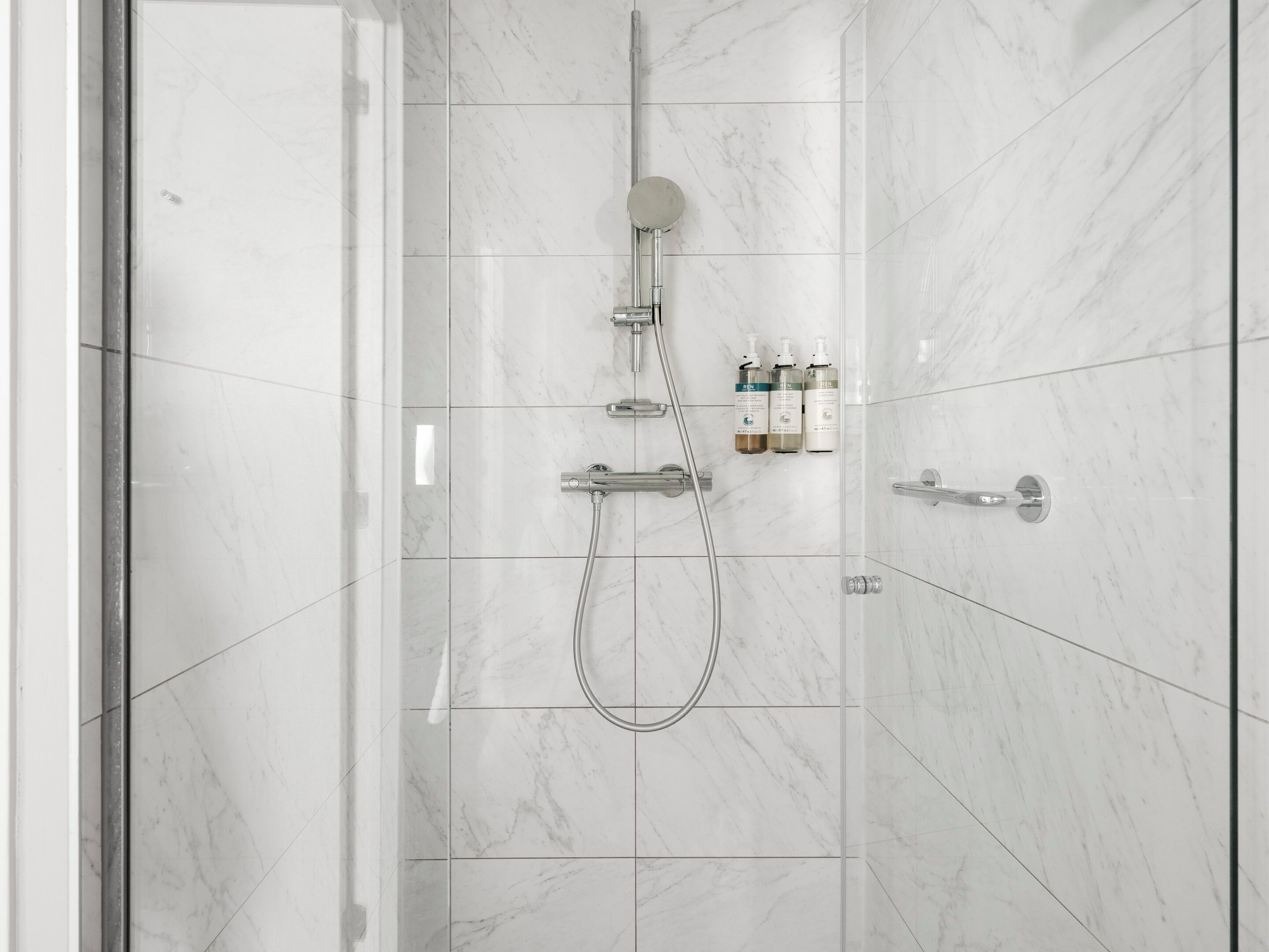 Designer toiletries, hair dryer, towels, soap