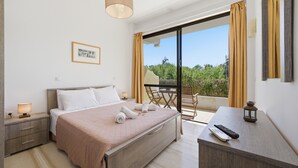 A hotel room with a bed, bedside table, lamp, and a view of the outdoors. - Studio Apartment 'Alexandra Studio 3' with Private Balcony & Wi-Fi (Lefkimmi)