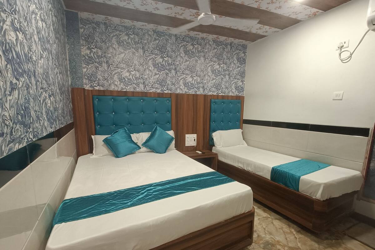 Habitación triple Deluxe | Wifi gratis y ropa de cama