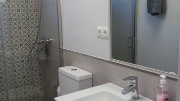 Shower, hair dryer, towels, toilet paper