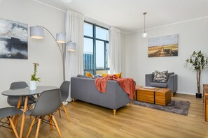 Classic Apartment | Living area | 42-inch TV with cable channels, Netflix, streaming services - The Axis 212 (Cape Town)