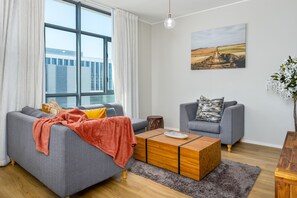 Classic Apartment | Living area | 42-inch TV with cable channels, Netflix, streaming services - The Axis 212 (Cape Town)