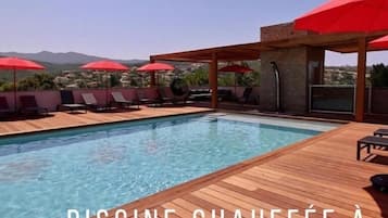 Seasonal outdoor pool, open 9:00 AM to 8:00 PM, pool umbrellas