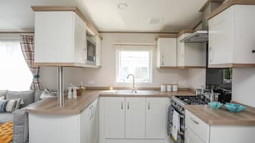 Fridge, electric kettle, cookware/dishes/utensils
