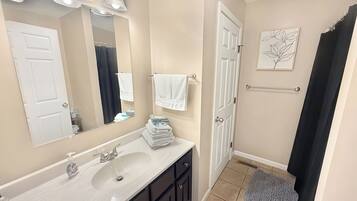 Combined shower/bathtub, hair dryer, towels, soap