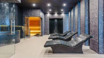 Relax in a serene space with a reception area, seating area, and modern shower.