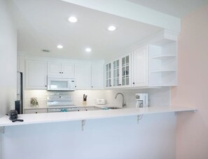 Fridge, microwave, oven, stovetop - Sundowner is a beautifully decorated condo on 7MB with the best sunset views (West Bay)